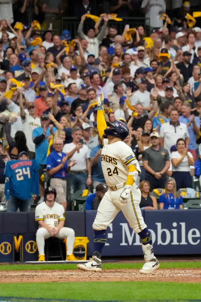 The Milwaukee Brewers’ William Contreras celebrates as he crosses home...