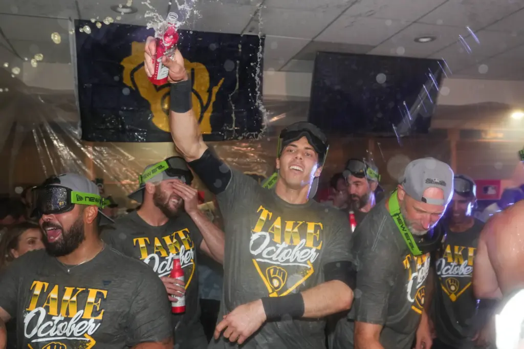 Milwaukee Brewers outfielder Christian Yelich, center, celebrates with teammates after...
