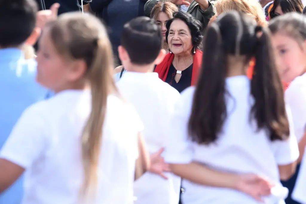 Dolores Huerta, 89, watches a performance by children during the...