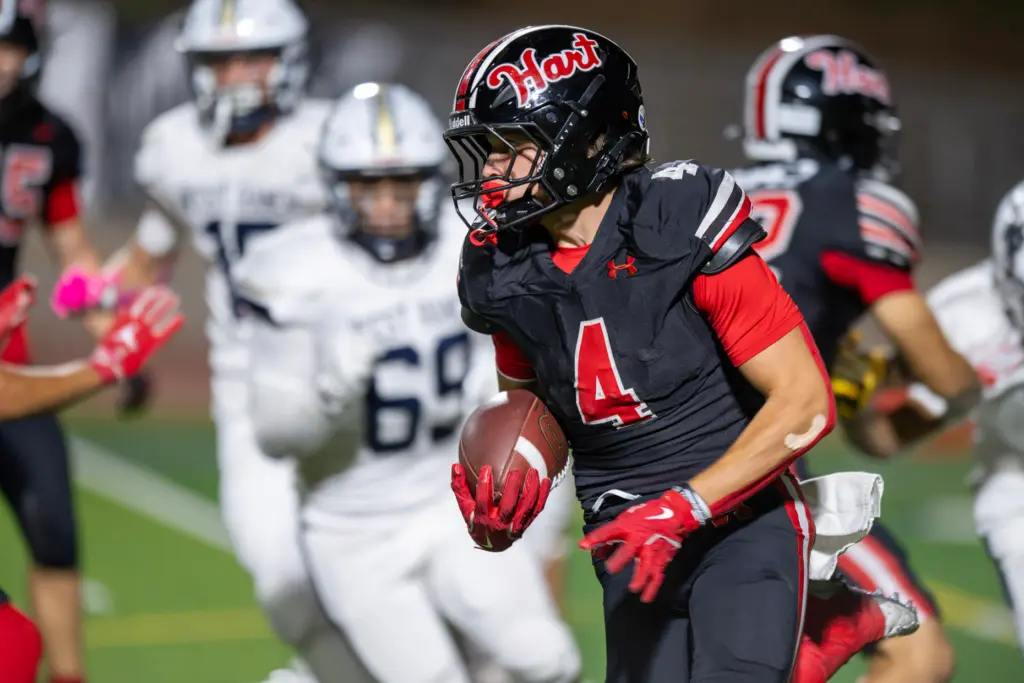 Hart High School’s Matix Frithsmith (4) carries the ball against...