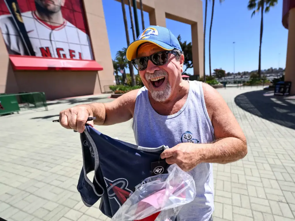 Donning a Los Angeles Rams hat, Dave Borzilleri, a 40-year...
