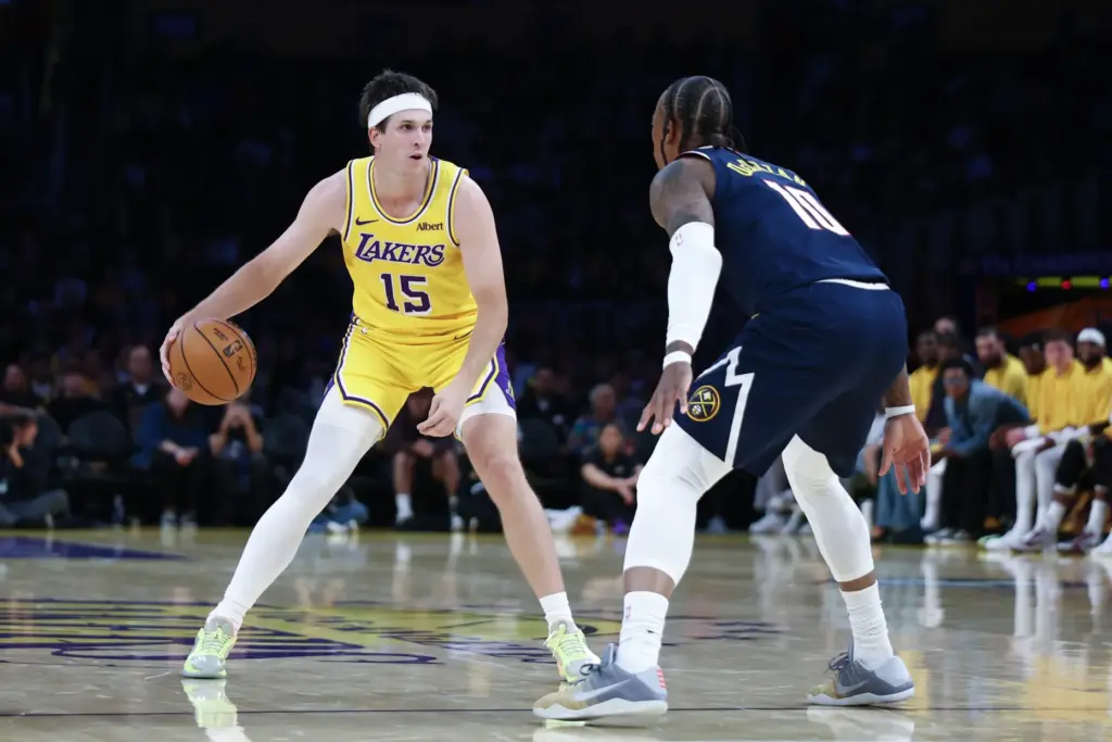 Lakers guard Austin Reaves handles the ball during the first...