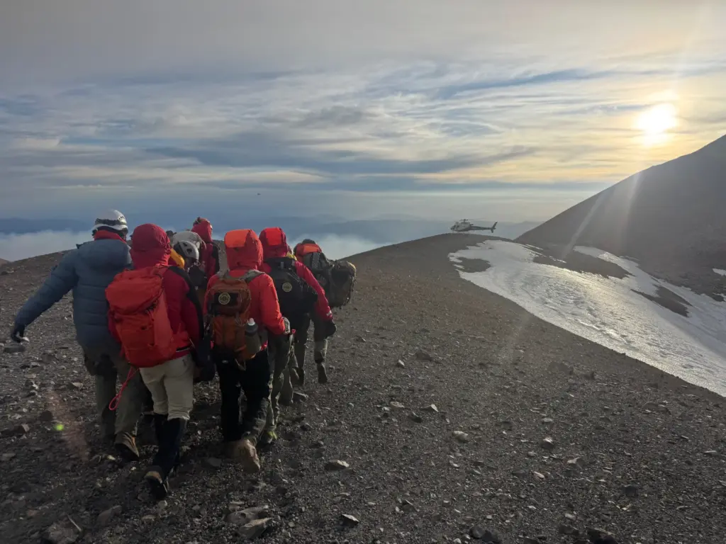 A team of volunteers from multiple agencies, climbed to the...