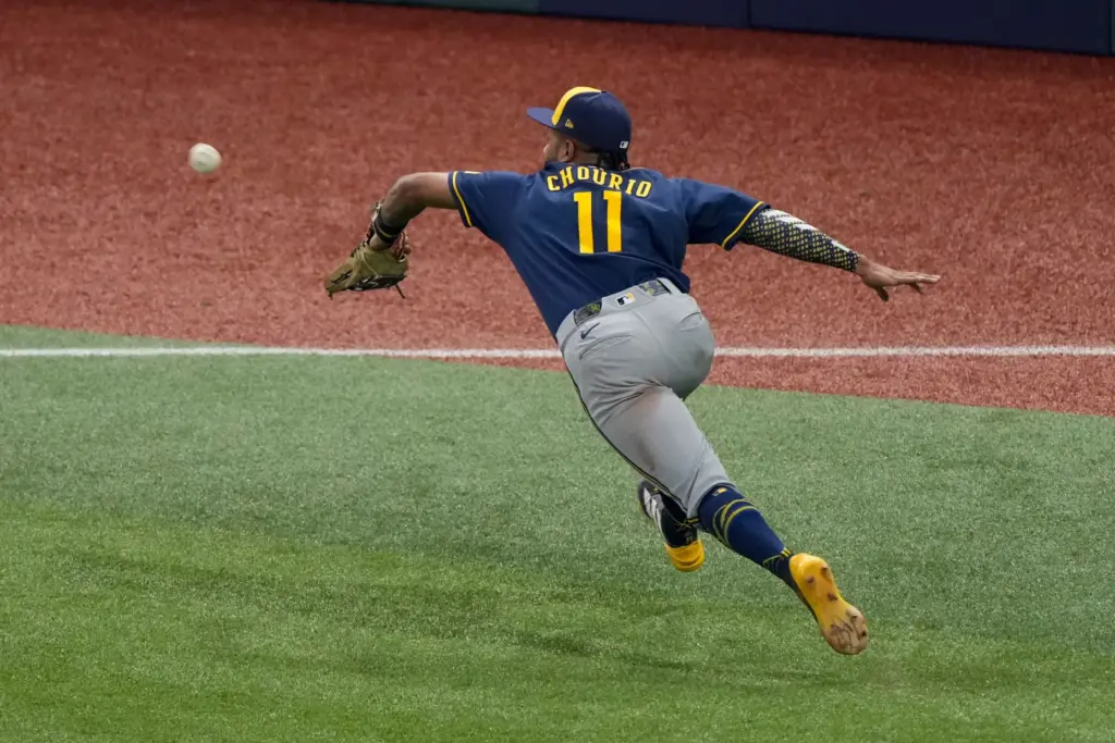 Milwaukee Brewers left fielder Jackson Chourio fields a fly out...