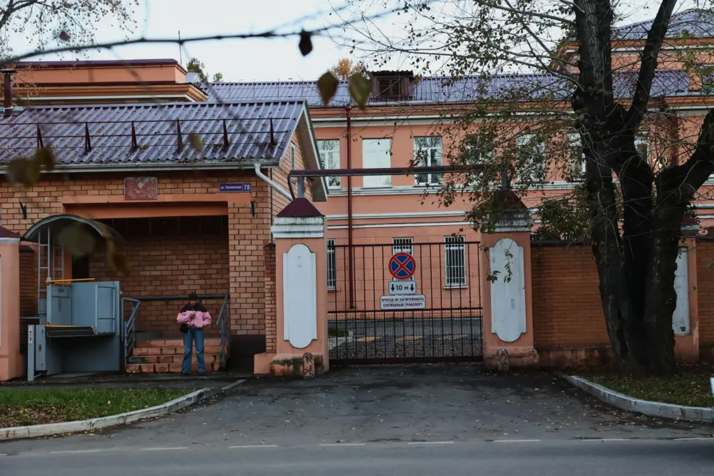 A pedestrian stands at the building of the Irkutsk Anti-Plague Research Institute of Siberia.