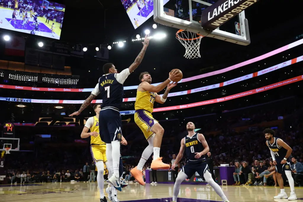 Lakers guard Luka Doncic (77) drives to the basket during...