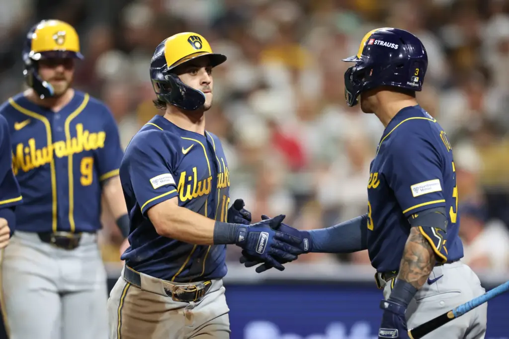 The Milwaukee Brewers’ Sal Frelick (10) is congratulated by Joey...