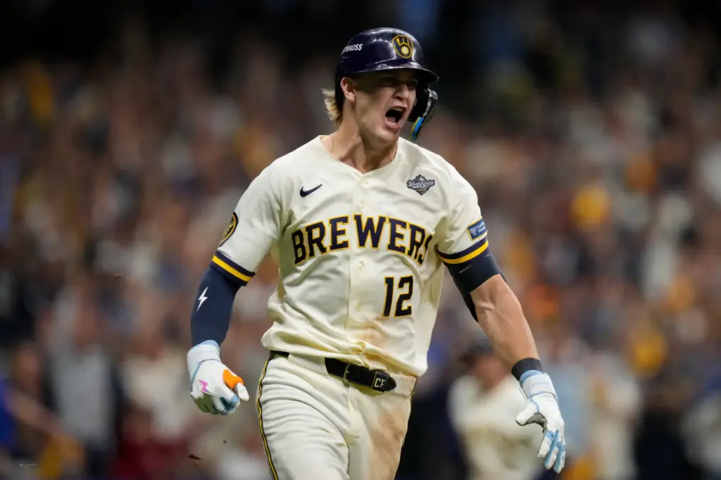 Milwaukee Brewers shortstop Cooper Pratt runs on his RBI base...