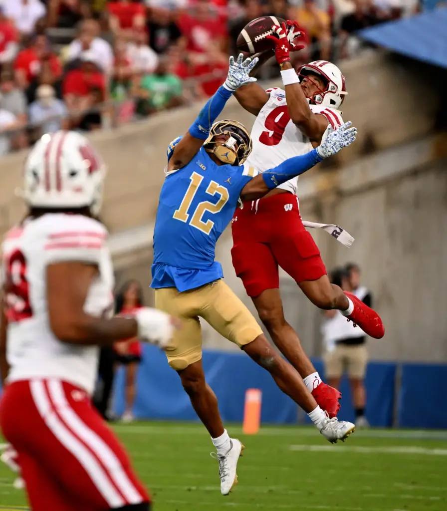 Wide receiver Jaylon Domingeaux #9 of the Wisconsin Badgers catches...