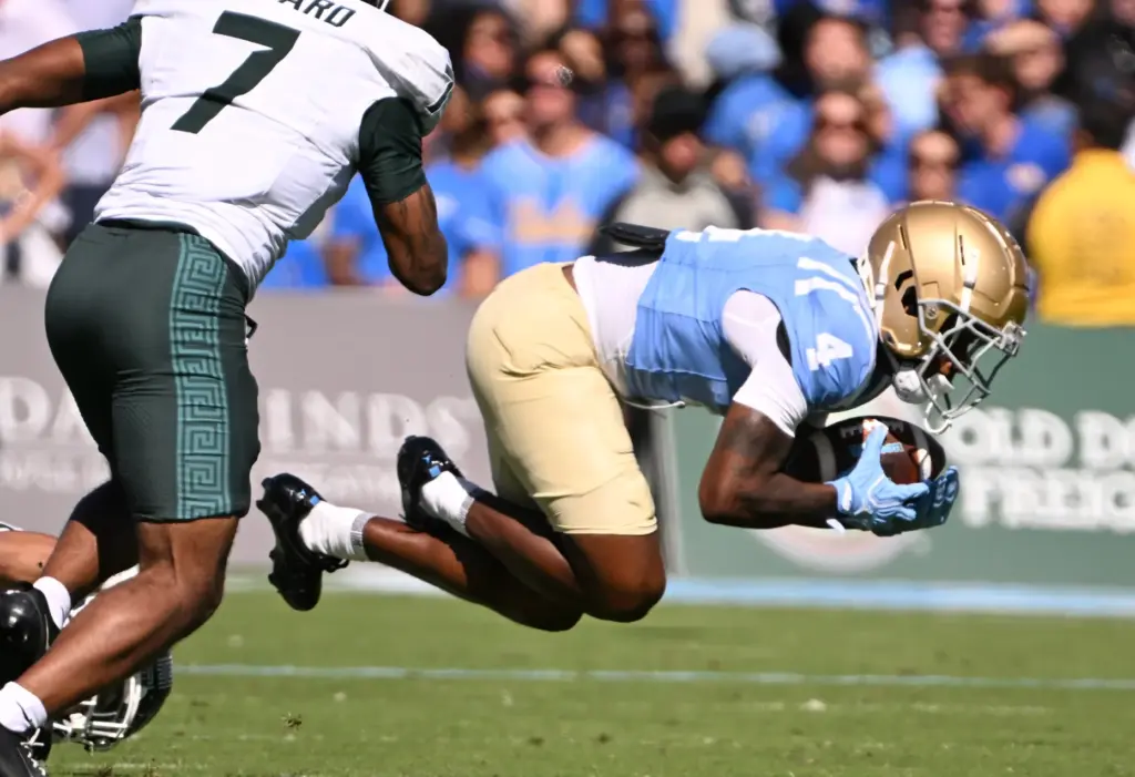 UCLA wide receiver Semaj Morgan (4) catches a pass for...