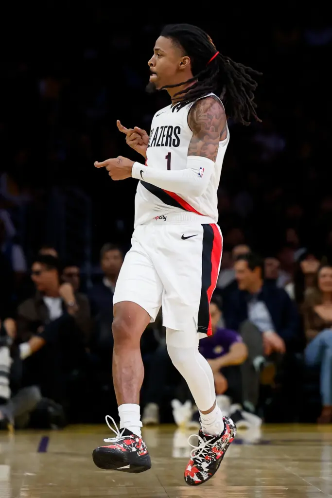 Portland Trail Blazers guard Ja Morant reacts after making a...