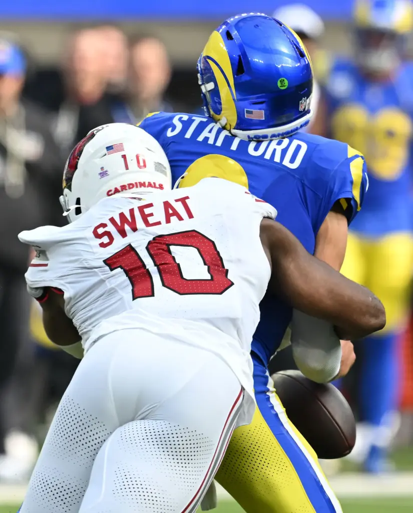 Rams quarterback Matthew Stafford (9) is sacked by Arizona Cardinals...