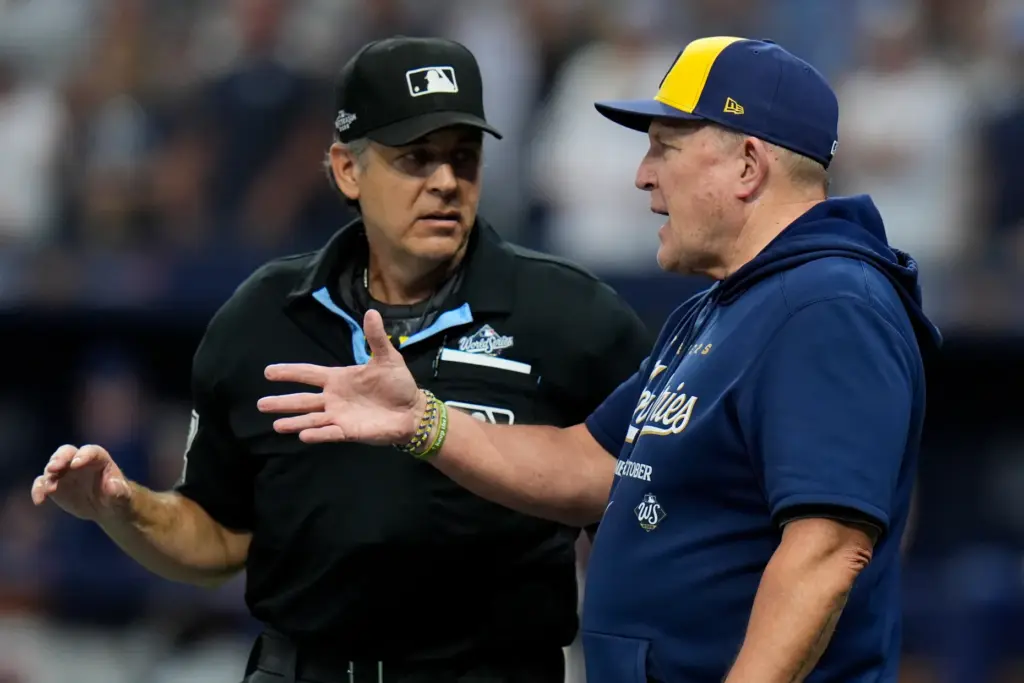 Milwaukee Brewers manager Pat Murphy argues a call with home...