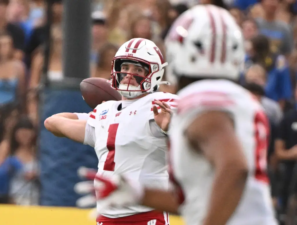 Quarterback Colton Joseph #1 of the Wisconsin Badgers passes against...