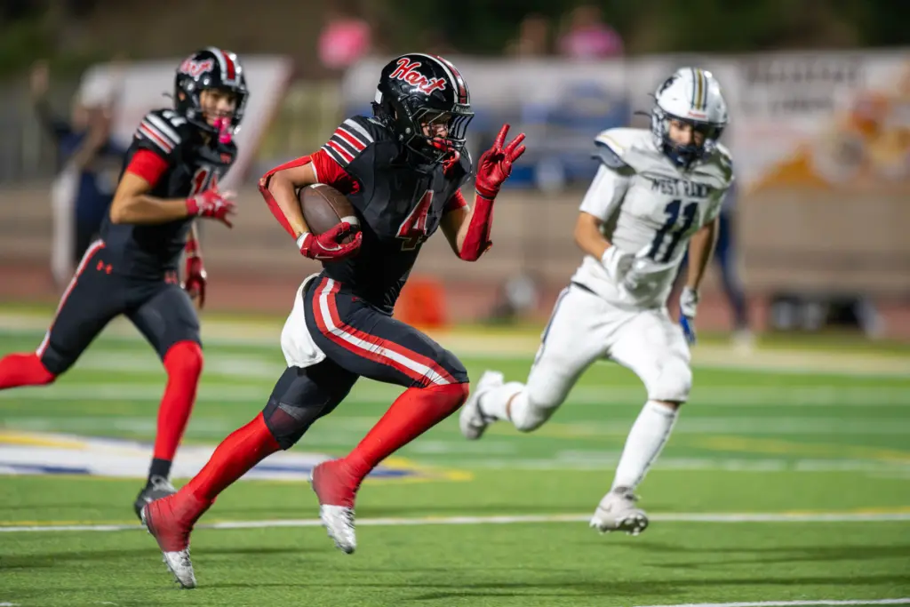 Hart High School’s Matix Frithsmith (4) carries the ball for...