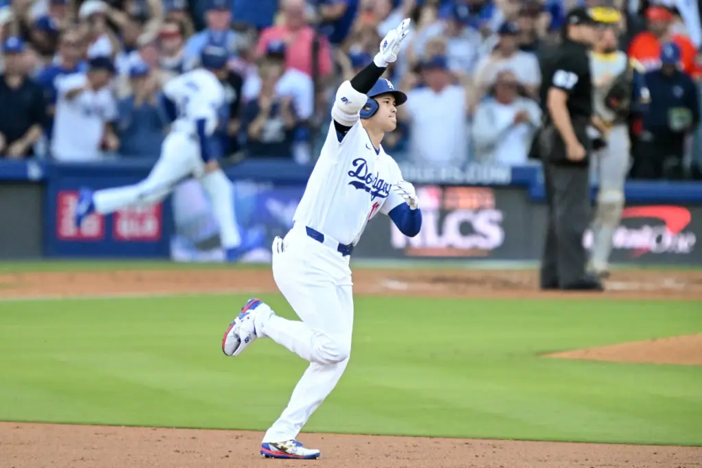 Dodgers star Shohei Ohtani celebrates as he runs the bases...