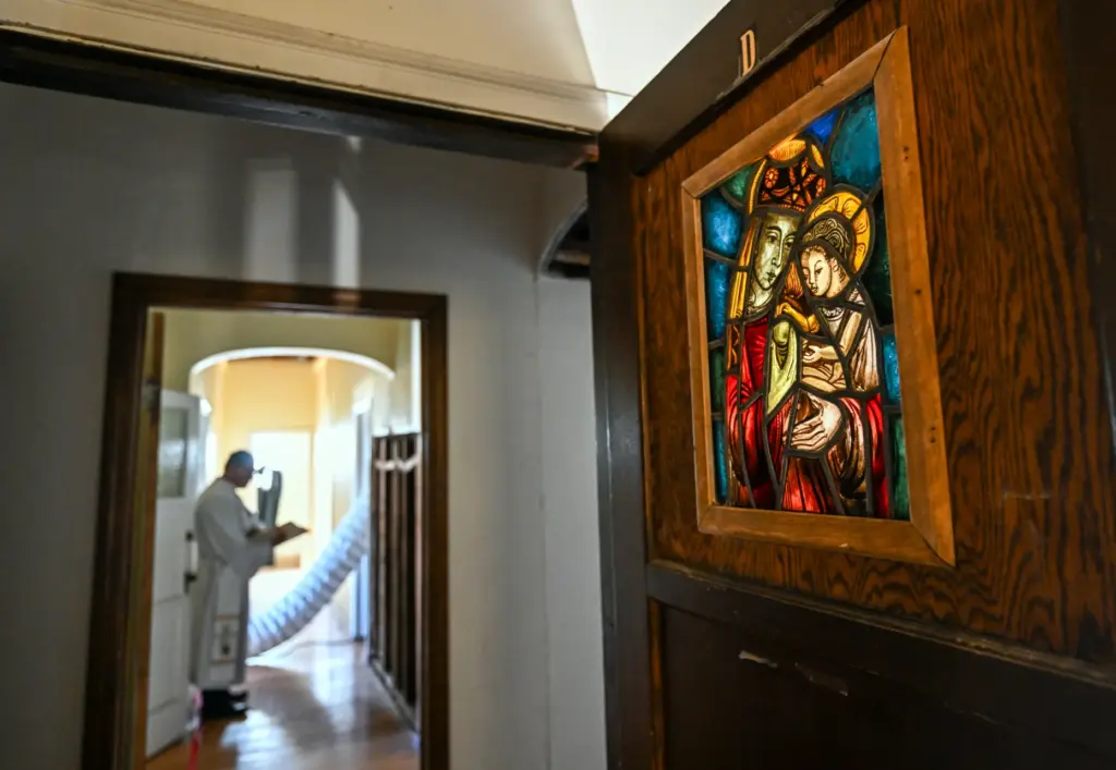 An original 1930s stained glass sits in a door at...
