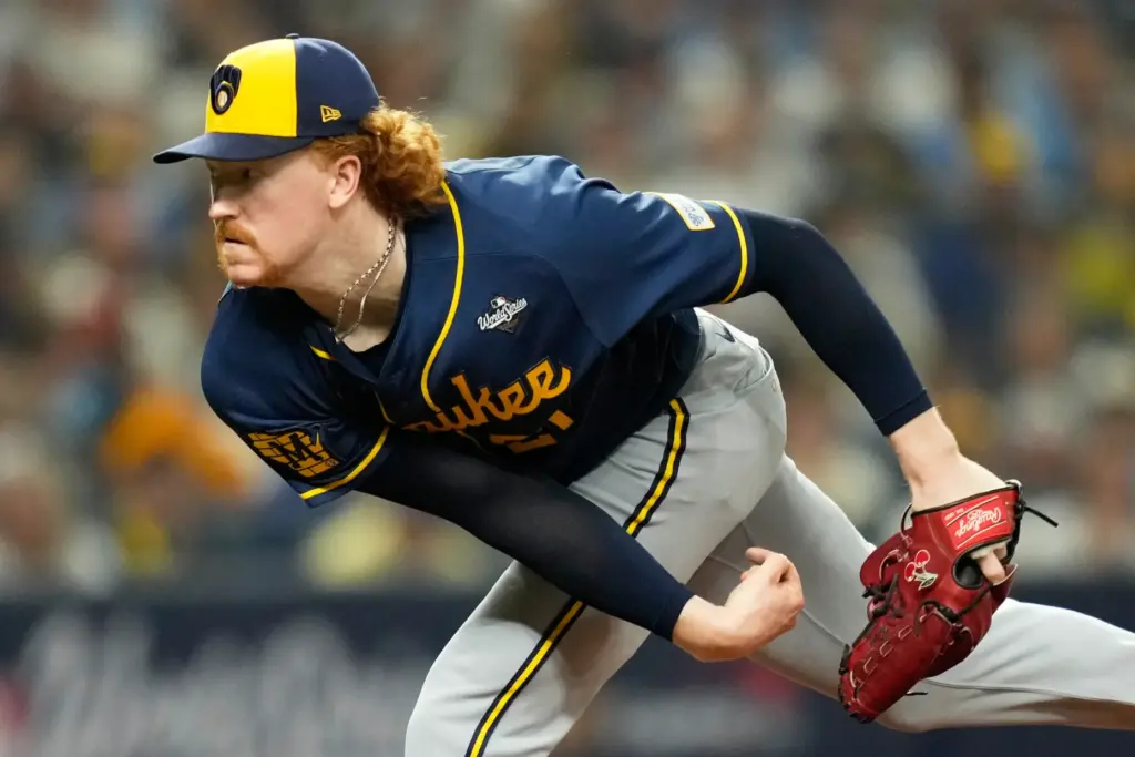 Milwaukee Brewers starting pitcher Dustin May throws to the plate...