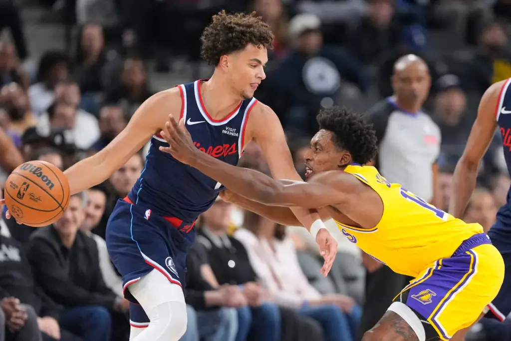 Clippers guard Keaton Wagler handles the ball as Lakers guard...