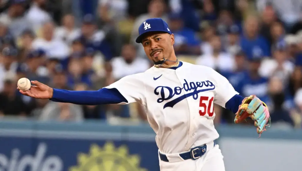 Dodgers shortstop Mookie Betts throws out the Milwaukee Brewers’ Andrew...