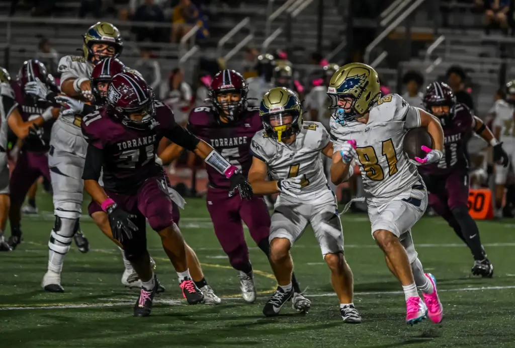El Segundo running back Rocco Taylor rushes with the ball...
