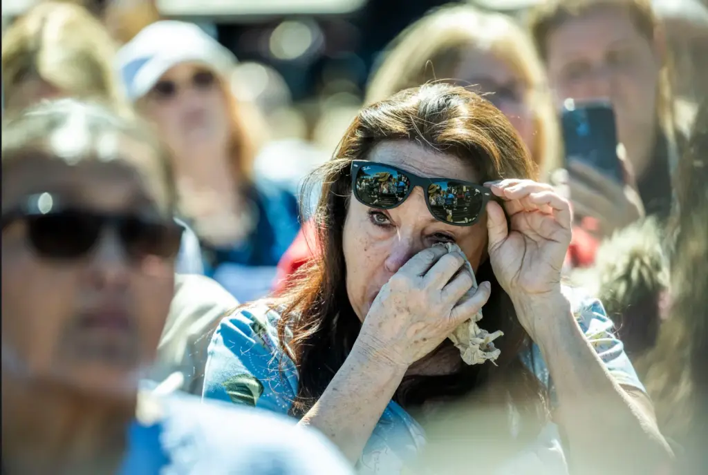 Jackie fan Mary Hohenbrink, 70, of Sacramento wipes away tears...