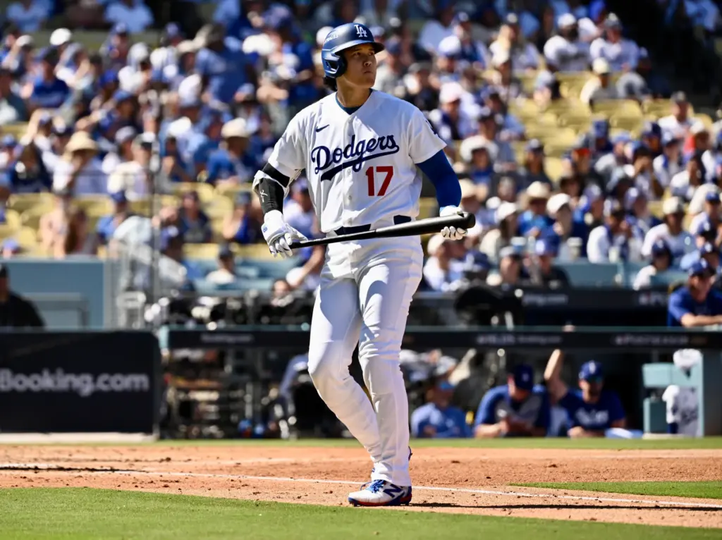 Dodgers star Shohei Ohtani reacts after lining out during the...
