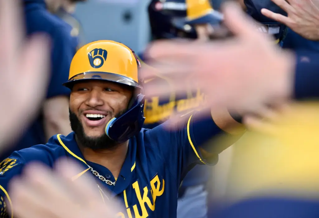 The Milwaukee Brewers’ Jackson Chourio celebrates with teammates in the...