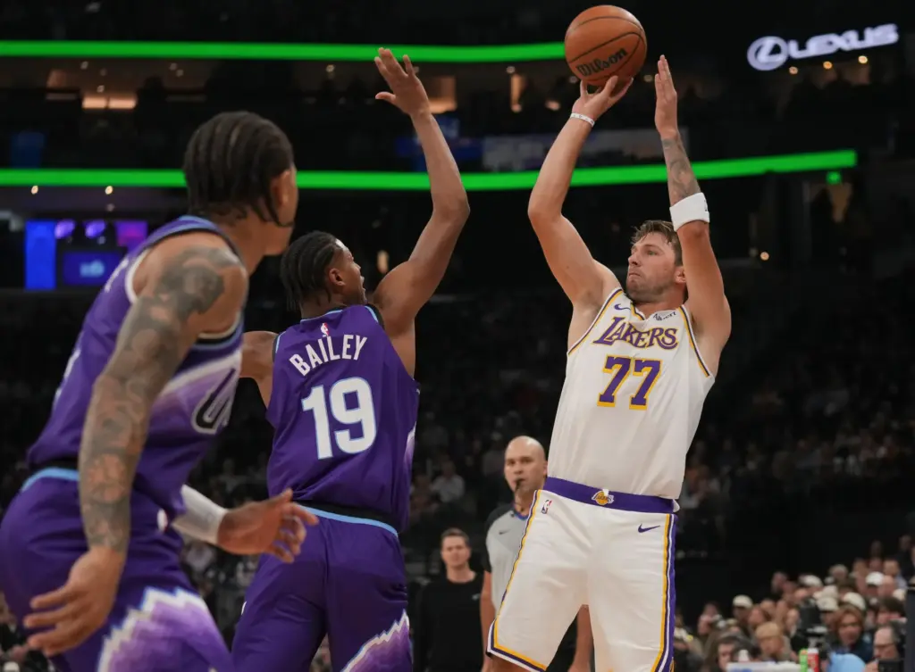 Lakers forward/guard Luka DonÄiÄ (77) looks to shoots as Utah...