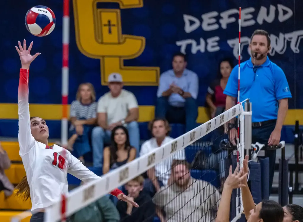 Redondo Union middle blocker Sienna Castillo (10) hits the ball...