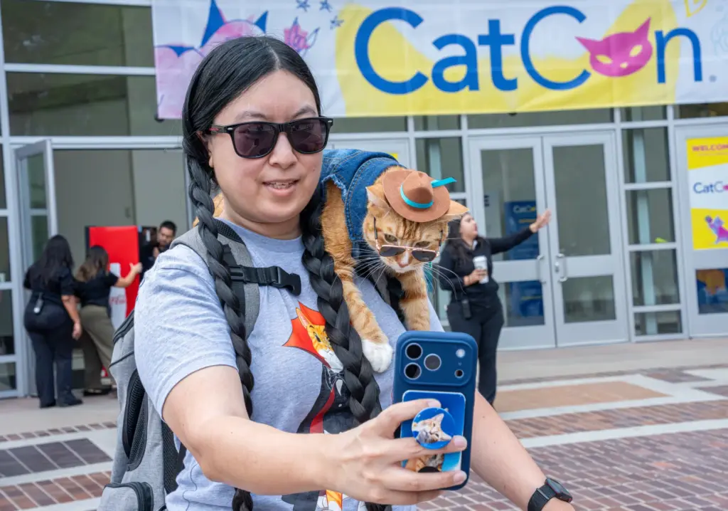 Ariel Shea, left, takes a selfie with her cat Calvin...