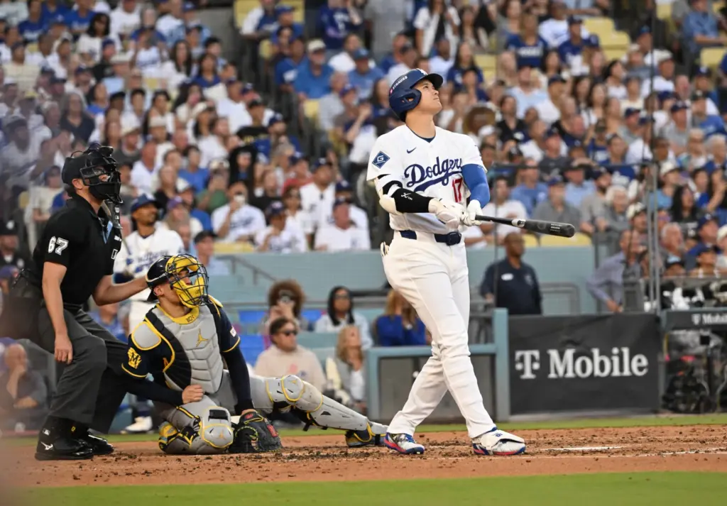 Dodgers star Shohei Ohtani watches the flight of his three-run...