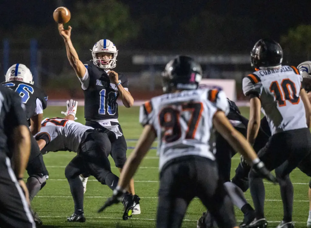 Dana Hills quarterback Carter Anderson (10) throws the ball during...