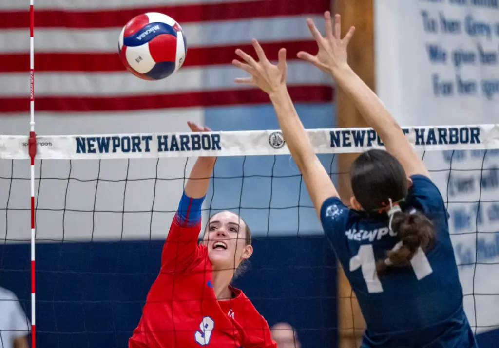 Los Alamitos outside hitter Lucy Sanzaro (9) hits the ball...