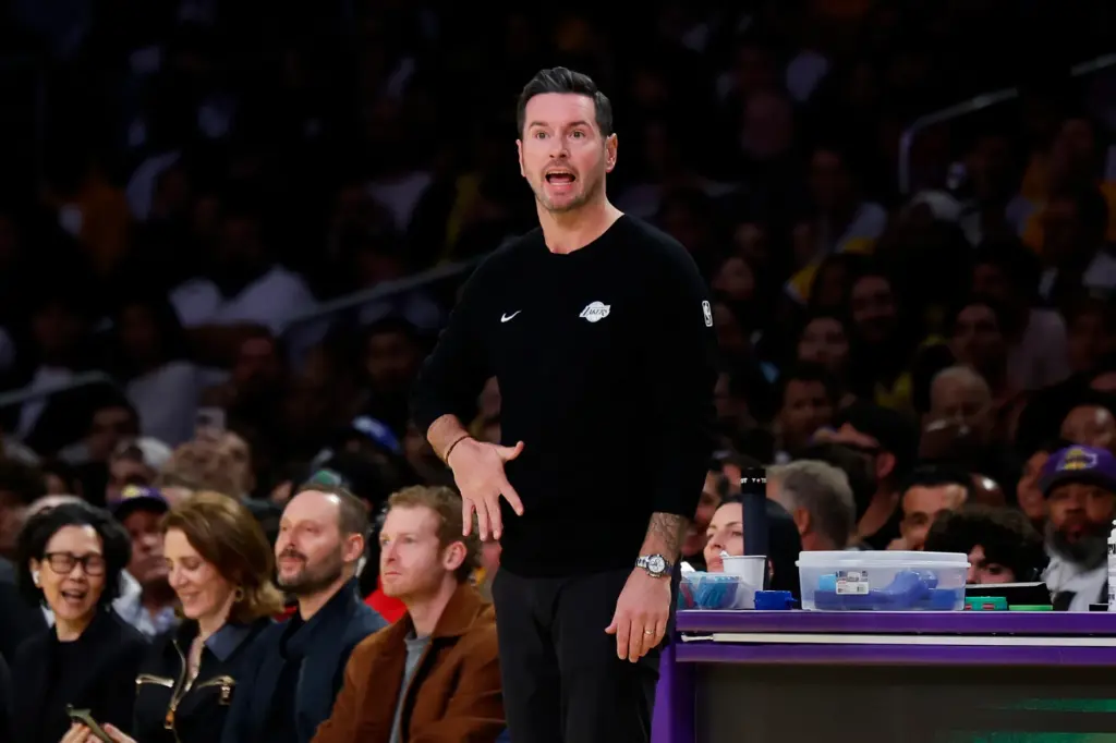 Lakers head coach JJ Redick yells out to his players...