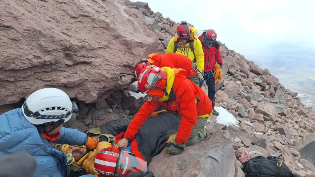 A team of volunteers climbed to the hiker.