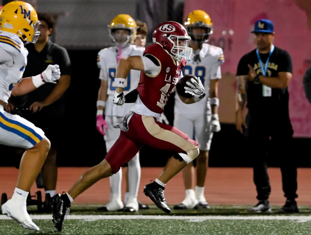 La Serna Lancers Landon Armenta (10) runs for a touchdown...