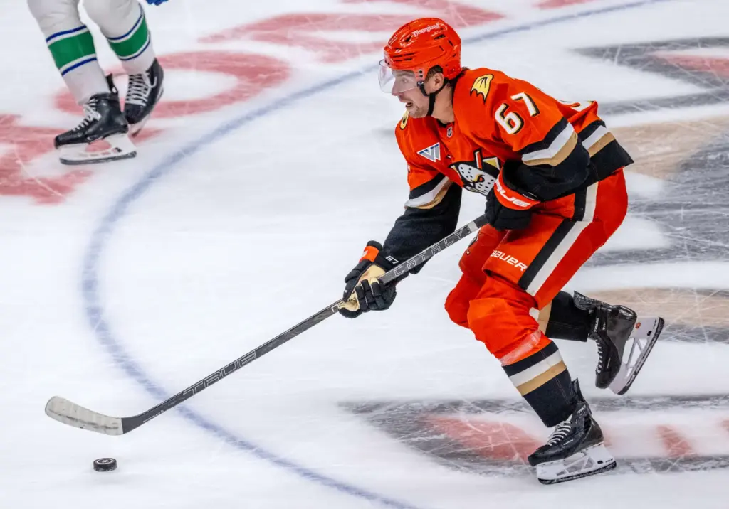 The Ducksâ Tristan Luneau brings the puck up the ice...