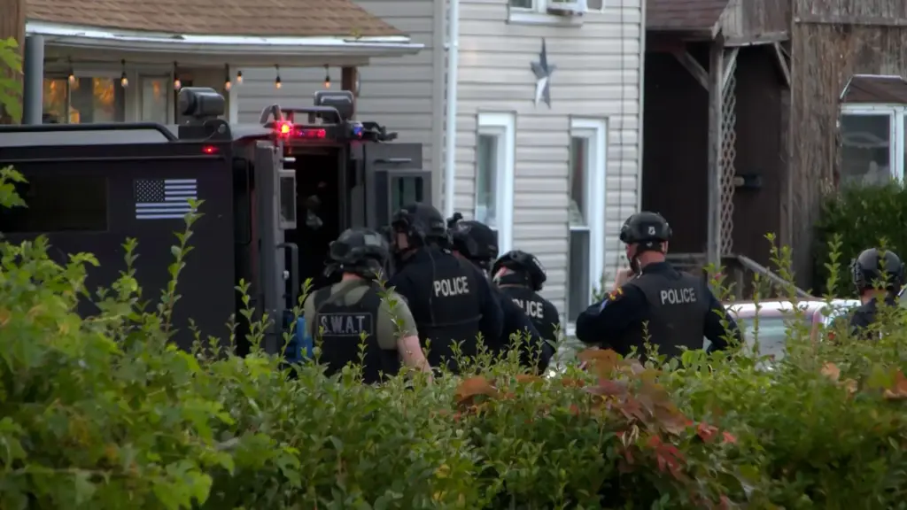 Police gather outside the scene of a shooting in Erie, Pennsylvania.