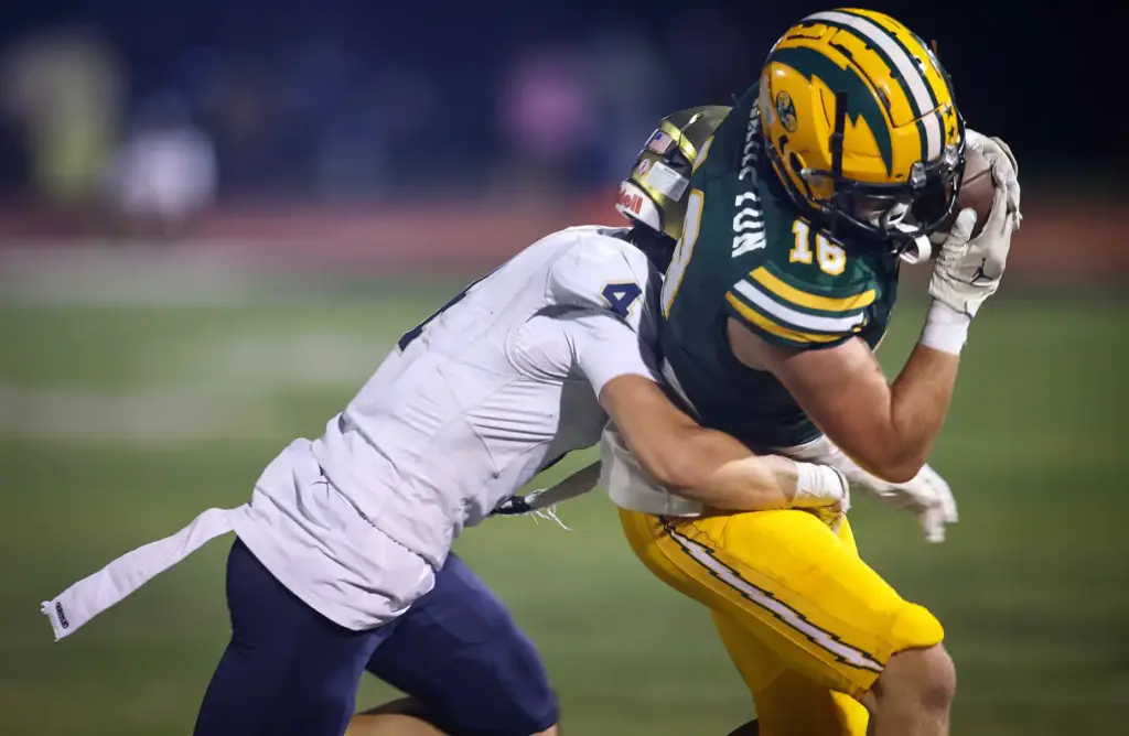San Juan Hillsâ Chayden Cadam, left, brings down Edisonâs Jack...