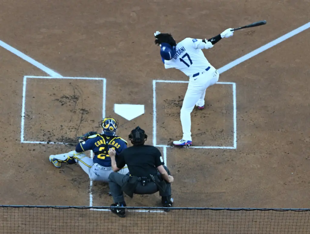 Dodgers star Shohei Ohtani loses his helmet as he strikes...