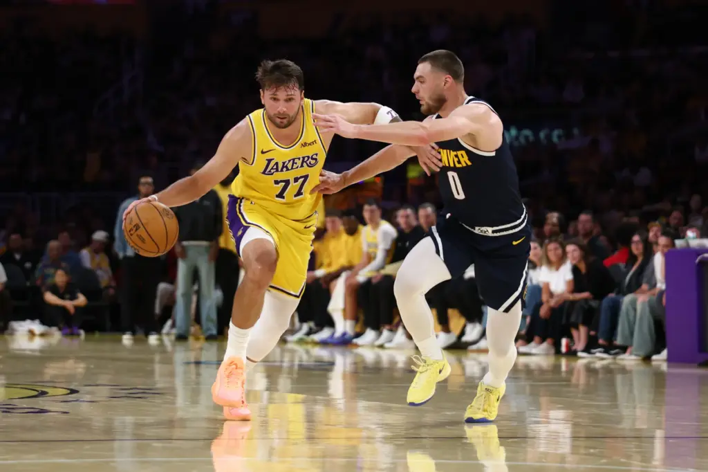 Lakers guard Luka Doncic brings the ball up the court...