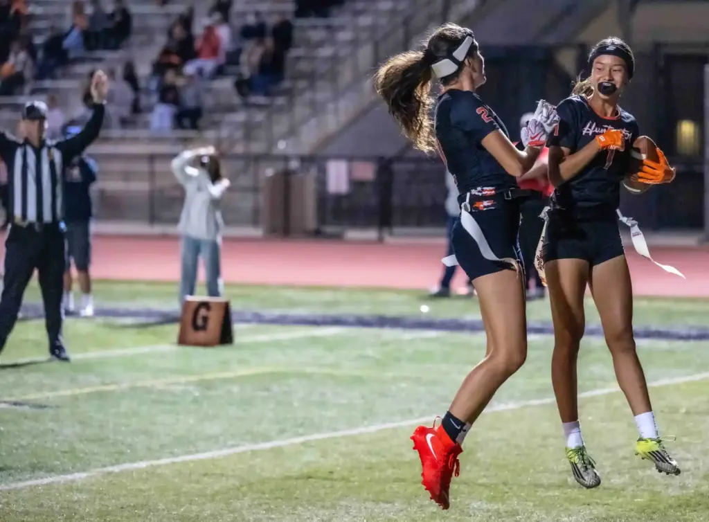 Huntington Beach players Brianna Massion (2), left, and Kyla Uno...