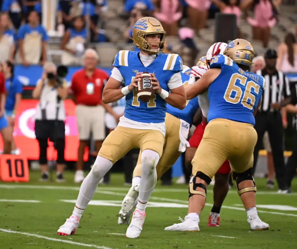 Quarterback Ty Dieffenbach #14 of the UCLA Bruins prepares to...