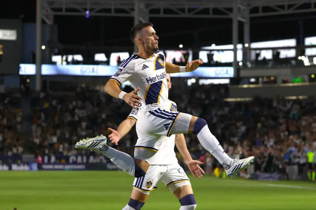 Los Angeles Galaxy midfielder Erik Thommy jumps in the air...