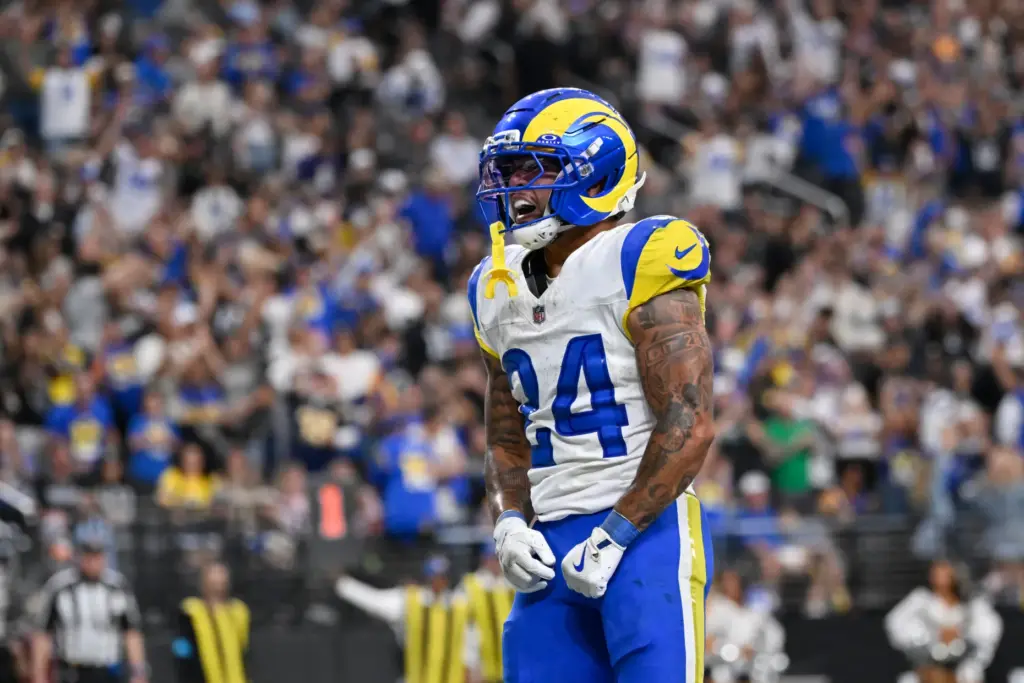 Rams running back Blake Corum reacts after scoring a touchdown...