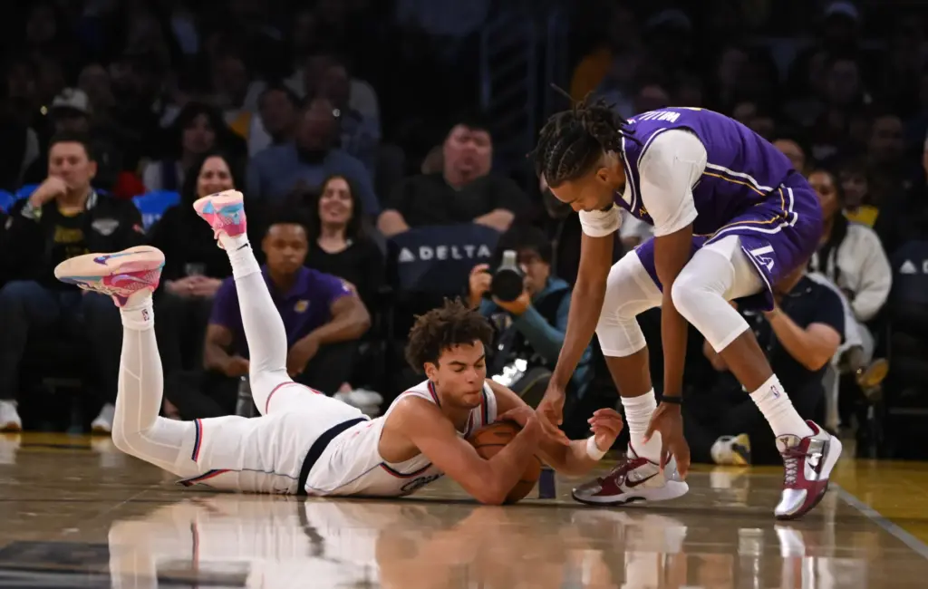 Clippers rookie guard Keaton Wagler, left, scrambles for a loose...