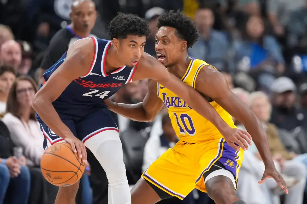 Clippers guard Cam Christie handles the ball as Lakers guard...