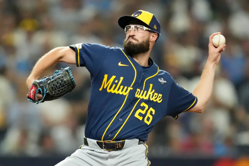 Milwaukee Brewers relief pitcher Aaron Ashby throws to the plate...