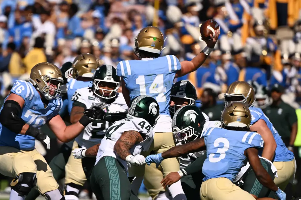 UCLA quarterback Ty Dieffenbach (14) throws a pass against Michigan...